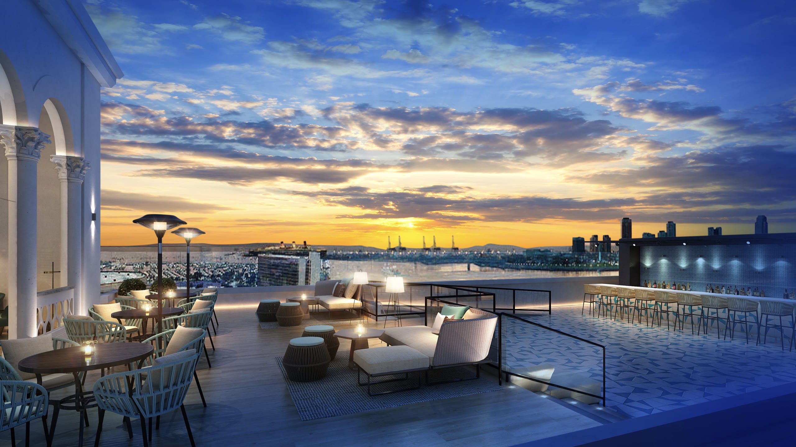 The rooftop seating area and bar at Halo Terrace at dusk at Fairmont Breakers in Long Beach, CA.